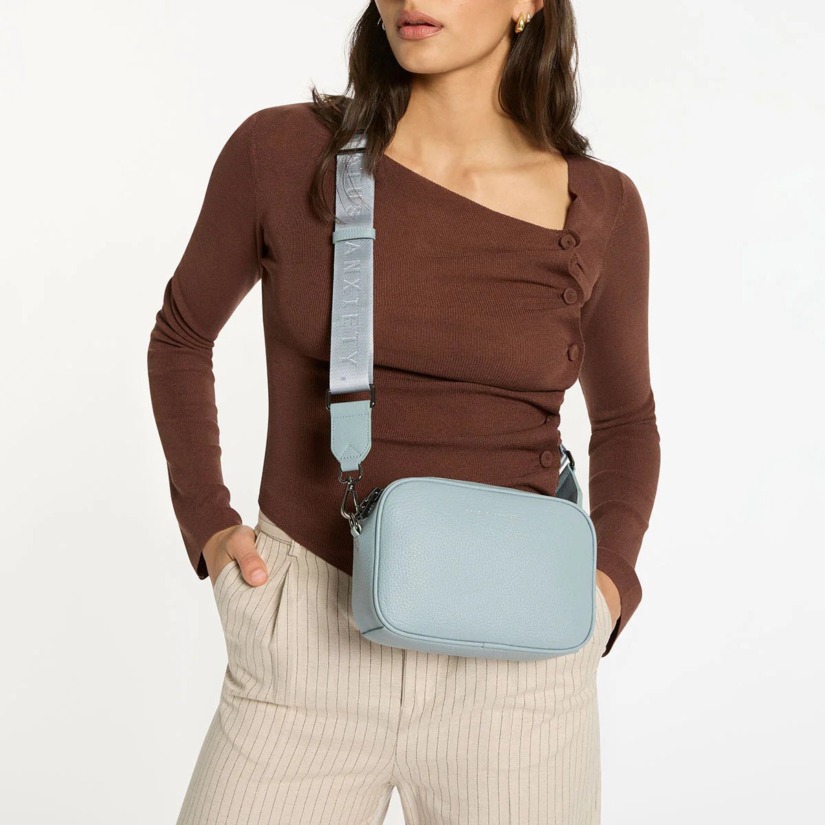 Plunder with Branded Webbed Strap in Powder Blue by Status Anxiety - The Stockroom NZ